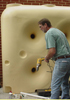 Man installing square poly tank